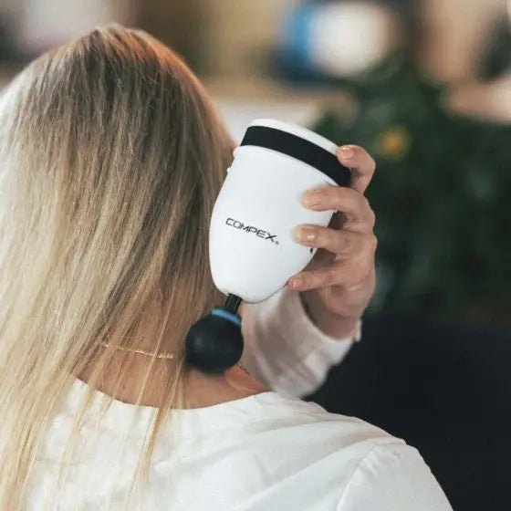 Compex Fixx Mini, appareil de massage portable pour soulager les tensions musculaires et améliorer la récupération.