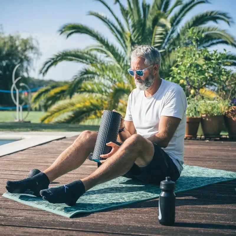 Rouleau de massage Ion Compex, conçu pour soulager les tensions musculaires et améliorer la circulation sanguine.