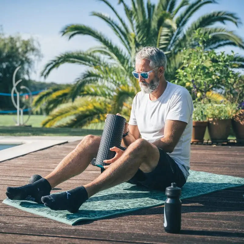 Rouleau de massage Ion Compex, conçu pour soulager les tensions musculaires et améliorer la circulation sanguine.
