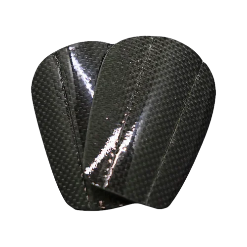 Protèges-tibias Carbone Flex en carbone, légers et résistants, offrant une protection maximale contre les chocs.